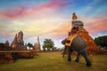 Tourists with an Elephant at Wat Chaiwatthanaram temple in Ayuthaya, Thailand Royalty Free Stock Photo