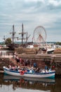 Tourists embarking sightseeing boat in Honfleur