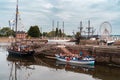 Tourists embarking sightseeing boat in Honfleur