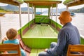 Tourists enjoy boat trip by Mekong river. Laos.