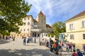 Tourists enjoy the courtyard of the famous Prague Castle Complex on a sunny day in early autumn in Prague, Czechia
