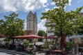 Tourists enjoy a day out in the restaurants of historic Ravensburg with the Frauentor Tower in the background