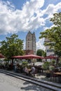 Tourists enjoy a day out in the restaurants of historic Ravensburg with the Frauentor Tower in the background