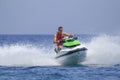 Tourists enjoy driving jetski