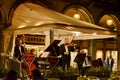 Tourists enjoy live music at a Cafe Restaurant in San Marco Square Royalty Free Stock Photo