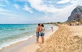 Tourists enjoy mediterranean sea in famous San Vito Lo Capo beach, Italy Royalty Free Stock Photo