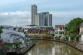 Tourists enjoy the relaxing atmosphere of the river, a famous tourist spot in Malacca, Malaysia.