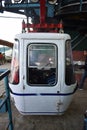 Tourists enjoy a ropeway cable car or Gondola ride over Darjeeling city . Foggy and golden hour. North east India tourism