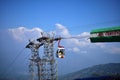 Tourists enjoy a ropeway cable car or Gondola ride over Darjeeling city . Foggy and golden hour. North east India tourism