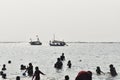 Tourists enjoy sea water at Ancol beach, Sunday 6 August 2023