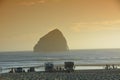 Tourists enjoy a sunset at Pacific City, Oregon Coast