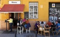 Tourists enjoy at traditional grocery store Urbina terrace typically Spanish cuisine. It located near Macarena square in