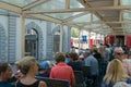 Tourists enjoy traveling in the open panorama carriage from Chur to Arosa