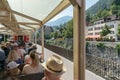 Tourists enjoy traveling in the open panorama carriage from Chur to Arosa