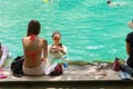 Tourists enjoy vacation travel in summer at natural emerald pool at Krabi