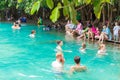 Tourists enjoy vacation travel in summer at natural emerald pool at Krabi