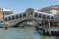 Tourists enjoy the view from Rialto bridge to grand canal on a sunny day in the old quarter San Polo in Venice, Italy Royalty Free Stock Photo
