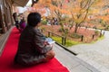 Tourists enjoy watching maple leaf in zen garden