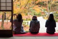 Tourists enjoy watching maple leaf in zen garden