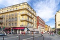 Tourists enjoy a wide colorful street of shops, markets and cafes leading to Old Town in the Mediterranean city of Nice, France Royalty Free Stock Photo