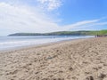 Tourists enjoying Aberdaron Beach in Wales on a late spring day