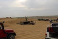 Tourists enjoying adventurous open jeep safari in Jaisalmer desert camp Royalty Free Stock Photo