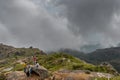 Four boys men trekking on mountaintop - cloudy weather Royalty Free Stock Photo