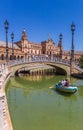 Tourists enjoying a boat ride in the canals of the Plaza Espana in Sevilla Royalty Free Stock Photo