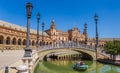 Tourists enjoying a boat ride in the canals of the Plaza Espana in Sevilla Royalty Free Stock Photo