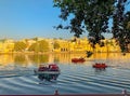 Tourists are enjoying boat ride in Pichola lake.