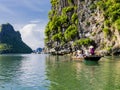 Tourists enjoying a boat trip in halong bay, Vietnam Royalty Free Stock Photo