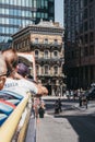 Tourists enjoying city views from top deck of of tour bus in London, UK Royalty Free Stock Photo