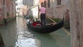 Tourists enjoying a gondola ride