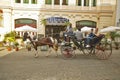 Tourists enjoying horse carriage ride in Old Havana, Cuba