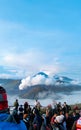 Tourists enjoying the landscape of Bromo Tengger Semeru National Park, Indonesia from a height after sunrise. Royalty Free Stock Photo