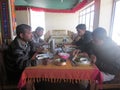 tourists enjoying meal in a small restaurant hotel in Leh during their vacation Royalty Free Stock Photo