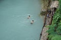 tourists enjoying a natural swimming pool, at the tourist spot Kedung Pedut, Yogyakarta, Indonesia. The unique and fresh river is