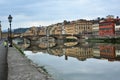 Florence city with tourists enjoying view on the Arno river in Italy Royalty Free Stock Photo