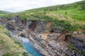 Tourists enjoying the stunning view of Studlagil canyon in Jokuldalur in east Iceland