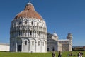 Tourists Enjoying Sunny Day in Front Of Baptistery at Leaning Tower of Pisa in Tuscany Italy Royalty Free Stock Photo