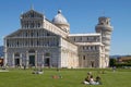 Tourists Enjoying Sunny Day in Front Of the Leaning Tower of Pisa in Tuscany Italy Royalty Free Stock Photo