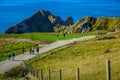 Tourists enjoying their time at Durdle Door in Dorset, England, UK