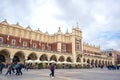 Tourists at Krakow Cloth Hall located in center of town square in the Krakow, Poland