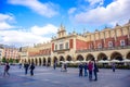 Tourists at Krakow Cloth Hall located in center of town square in the Krakow, Poland