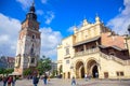 Tourists at Krakow Cloth Hall and and Town Hall Tower located in center of town square in the Krakow, Poland Royalty Free Stock Photo