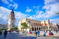 Tourists at Krakow Cloth Hall and and Town Hall Tower located in center of town square in the Krakow, Poland Royalty Free Stock Photo