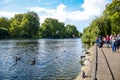 Tourists enjoying their time at St James`s Park Lake in St James`s Park, London, England, UK