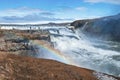 Tourists enjoying view of Gullfoss waterfall in Golden Circle against blue sky Royalty Free Stock Photo