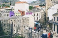 Tourists enjoying the view old brigde in Mostar Bosnia and Herzegovina