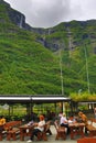 Kjelfossen waterfalls tourists outdoor seatings Gudvangen Norway